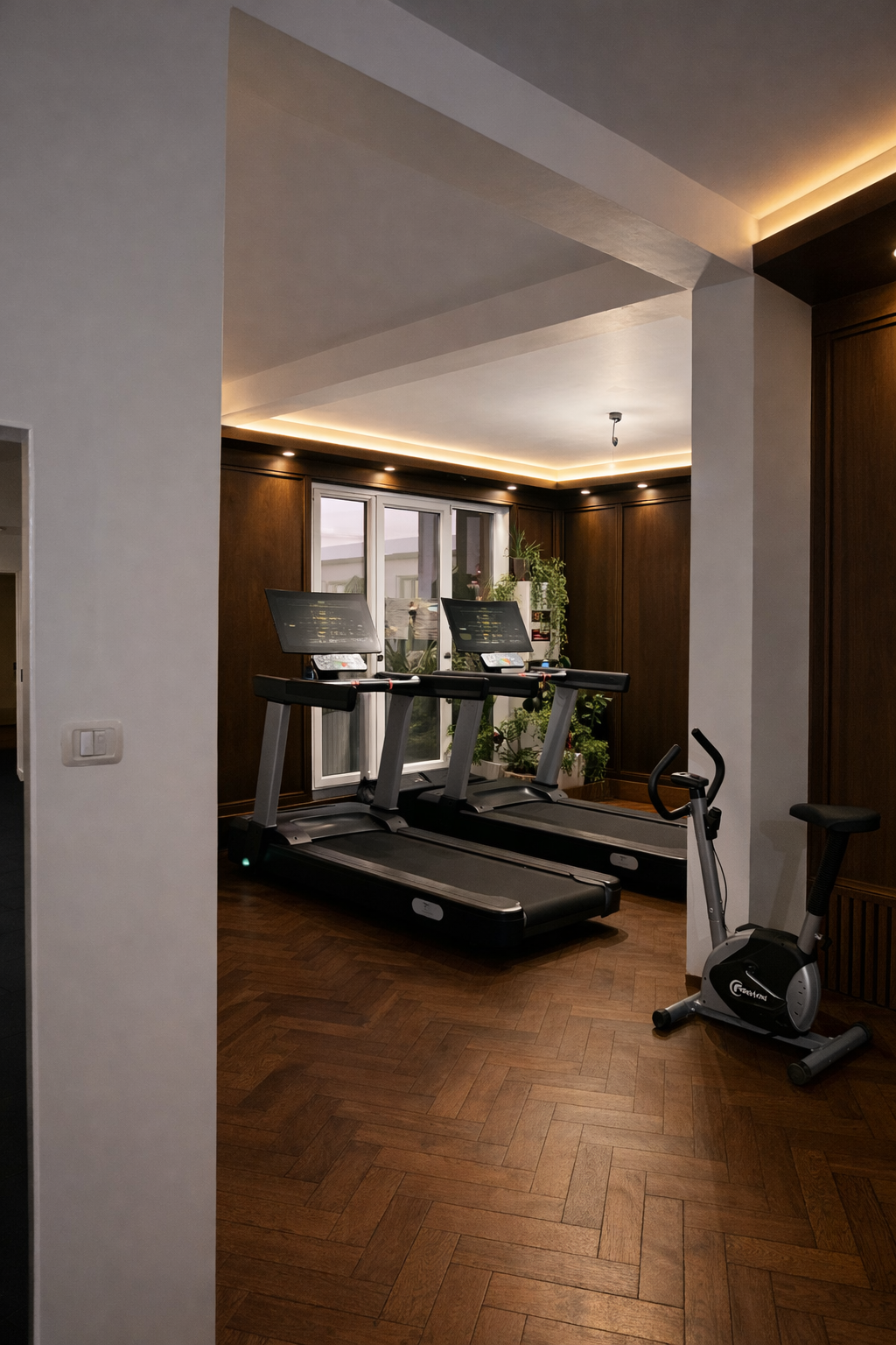 Commercial smart treadmill positioned inside modern home gym interior space.