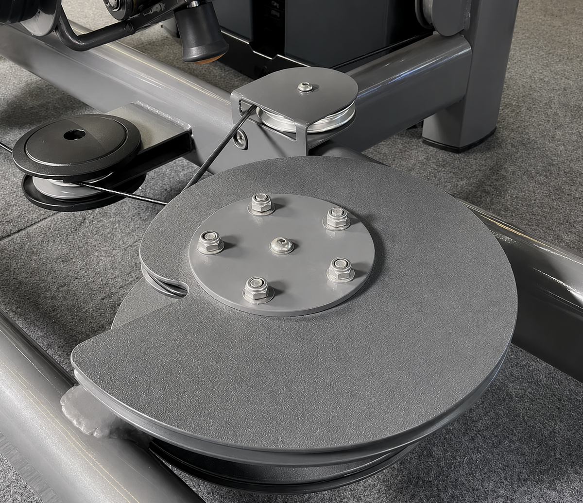 Commercial seated leg press cable and pulley mechanism detail