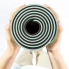 Beige non slip yoga mat with alignment guide lines for posture training
