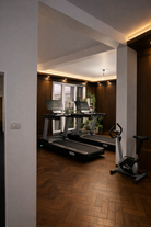 Commercial smart treadmill positioned inside modern home gym interior space.