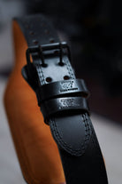 leather lifting belt used in gym training for compound lifts and strength exercises