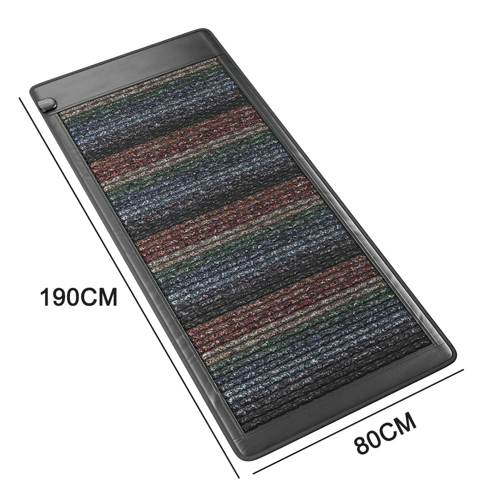 Folded PEMF therapy mat showing thickness and stitched edge detail.