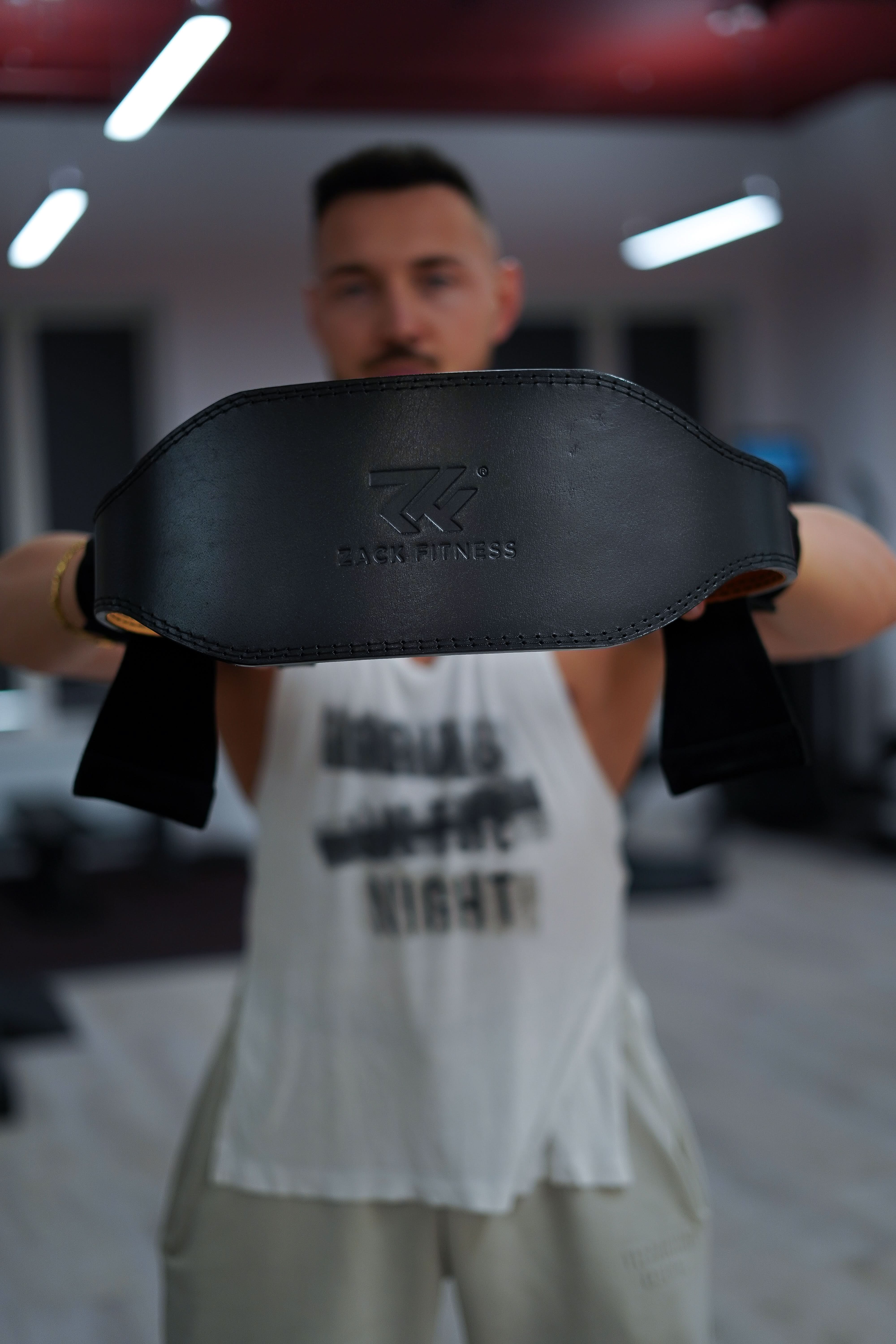 rear view of a weightlifting belt providing lumbar support during compound lifts