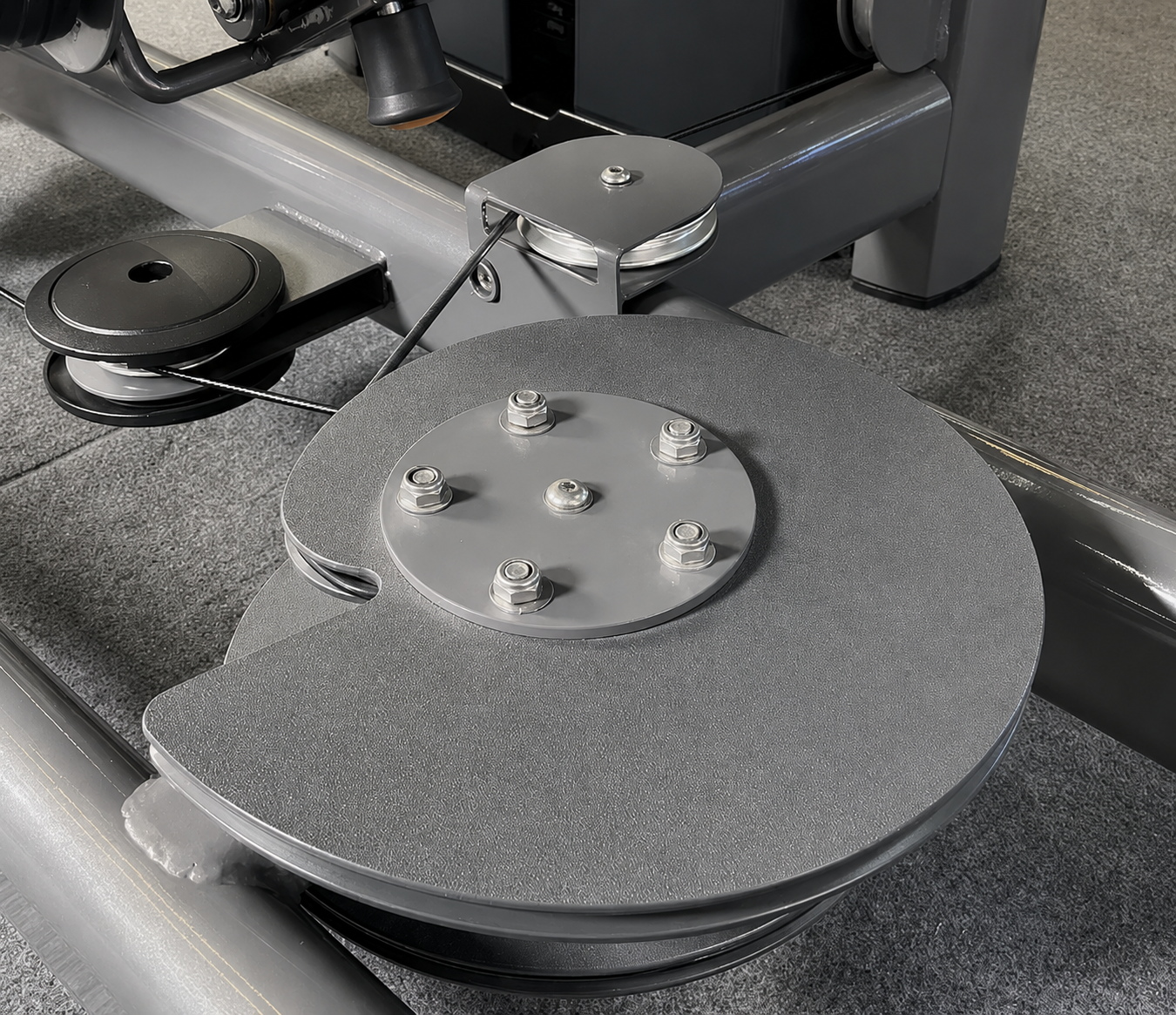 Commercial seated leg press cable and pulley mechanism detail