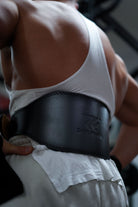 close-up of double prong stainless steel buckle on a leather weightlifting belt for secure fit
