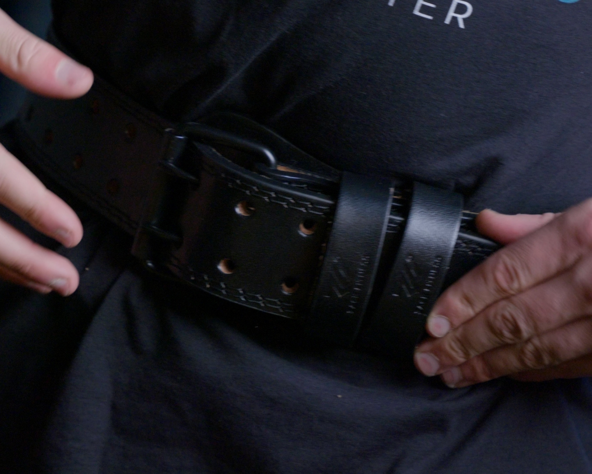 weightlifting belt designed to support the lower back during heavy strength training